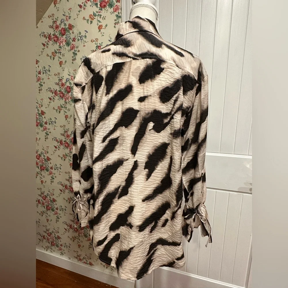 Black and cream zebra print button up blouse with tie at wrist and ruffle cuff - Picture 4 of 7